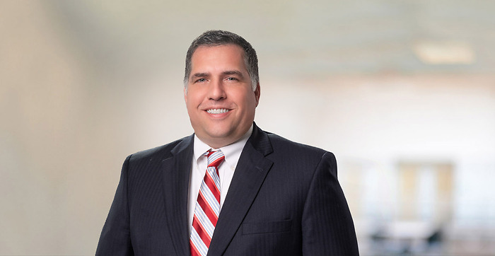 Professional Photo of man with Black Suit and red striped tie